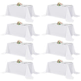 Sancua white rectangular tablecloth 90x132 inches on a 6-foot table for bulk events.