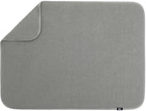 S&T INC. Dish Drying Mat XL on the counter absorbs water to keep surfaces dry.