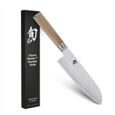 Shun Classic Blonde Santoku blade exposing VG-MAX core for precise vegetable cuts.