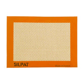 Silpat premium non-stick baking mat on a toaster oven tray for easy, mess-free baking.