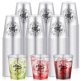 Sliner Happy New Year 2 oz shot glasses on table, clear plastic for parties