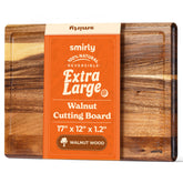 Smirly walnut cutting board with a deep juice groove for mess-free prep.