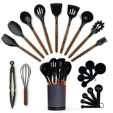 Smirly kitchen utensils set overview with wood handles.