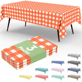 Smiry orange gingham tablecloth 54x108, durable disposable cover for outdoor dining.