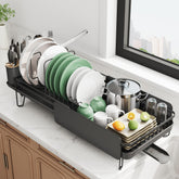 SNTD extendable dish drying rack on a compact counter with adjustable length.