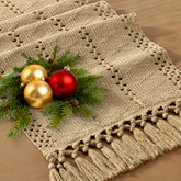 Socomi boho table runner with macrame edges for a warm, rustic dining room.