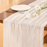 Socomi ivory cheesecloth table runner, 120 inches, adds soft rustic charm to wedding tables.