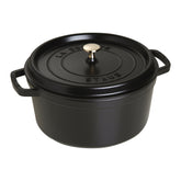 STAUB cast-iron Dutch oven 7qt round body highlights even heat for uniform cooking.