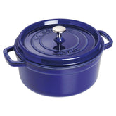 Staub 4qt round cocotte in dark blue, durable enamel for slow-cooked meals.