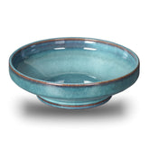 STE-CER ceramic fruit bowl with blue pedestal glaze enhances countertop organization.