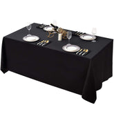 Surmente black tablecloth 90x132 on a rectangular table for elegant coverage.