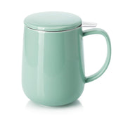 Sweese 20 oz porcelain tea mug with infuser and lid in mint-green, ideal for cozy mornings.