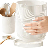 Swicken white ceramic utensil holder on counter for organized kitchen tools.