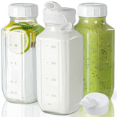 Syntic glass juice bottle with lids for leak-free transport.