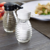 Tablecraft moisture-proof beehive salt and pepper shakers with a black flip-top lid for reliable pouring.