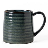 The TaoTaojarvie 21 oz mug with dark green transmutation glaze for bold coffee.