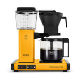 Technivorm Moccamaster KBGV yellow pepper front view highlighting compact kitchen-friendly design.