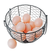 TENINYU egg basket in powder-coated steel keeps eggs organized on the kitchen counter.