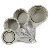 The French Culinary Institute collapsible measuring cup set gray, assembled for space-saving storage.