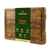 thetchry teak end grain cutting board with juice groove helps contain mess during prep.