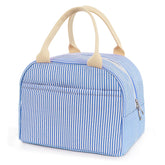 TIFFYONEK lunch bag front pocket keeps utensils and phone within easy reach.