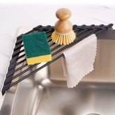 Tomorotec triangle roll-up rack fits sink corners for compact dish drying.