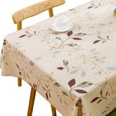 TruDelve heavy-duty vinyl tablecloth in beige drapes softly to protect your table.
