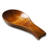 Tvvtuww acacia wood spoon rest on counter to reduce drips during cooking.