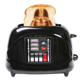 Uncanny Brands Darth Vader toaster helmet pops for playful mornings.
