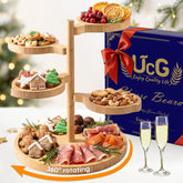 UTCG tiered charcuterie board on dining table as centerpiece for entertaining.