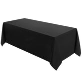 VidaFete 90x132 black tablecloth on table, showcasing durable stain resistance.
