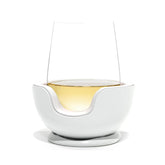 VoChill stemless wine glass chiller on table maintains wine temperature.
