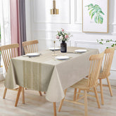 Vonabem waterproof rectangle tablecloth in beige protecting a dining table from spills.