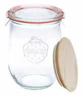 WECK 745 Tulip jar with wooden lid on counter, stylish plastic-free storage option.