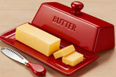 WERTIOO butter dish with lid on countertop showing bold red color and clean appearance.