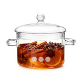 WETPYAKS glass pot on stove with lid for safe cooking and monitoring.