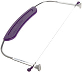 Wilton adjustable cake leveler shows precise domed-top trimming for even cake layers.