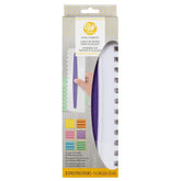 Wilton comb icing smoother 3-piece assembly showing textured buttercream edges