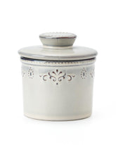 Xela butter crock with water line keeps butter fresh and soft on the counter.