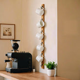 Yohsnor wall-mounted mug rack with six hooks for organized kitchen storage.