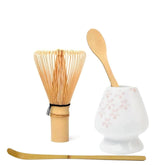 YRDGRG matcha whisk holder in cherry blossom porcelain, ideal for traditional tea ceremony display.