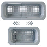 YUNKWONG extendable sink colander over sink in gray for quick vegetable washing.