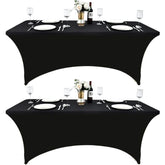 ZarzaaSik 6ft black spandex table cover on table provides a sleek, professional look for events.