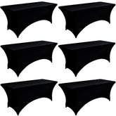 ZarzaaSik 6ft black spandex table cover on a folding table for a sleek, smooth surface.