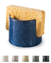 Zoeeker blue ceramic sponge holder sits neatly on the sink edge.
