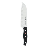 ZWILLING Twin Signature 7-inch hollow-edge Santoku blade for precise slicing.