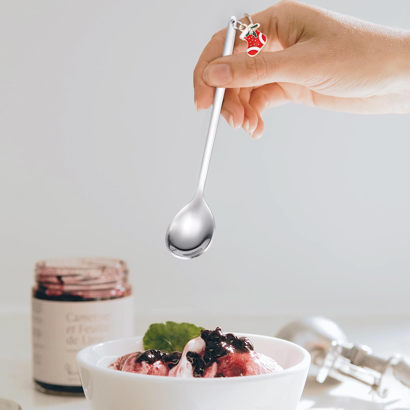 A · HOUSEWARE closeup of Christmas pendants on spoons.