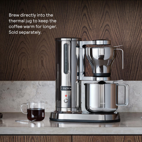 Aarke complete brewing solution includes carafe, spoon, basket, and cloth.