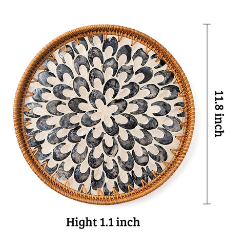 Handwoven round tray highlights eco-friendly rattan and craftsmanship for home decor.