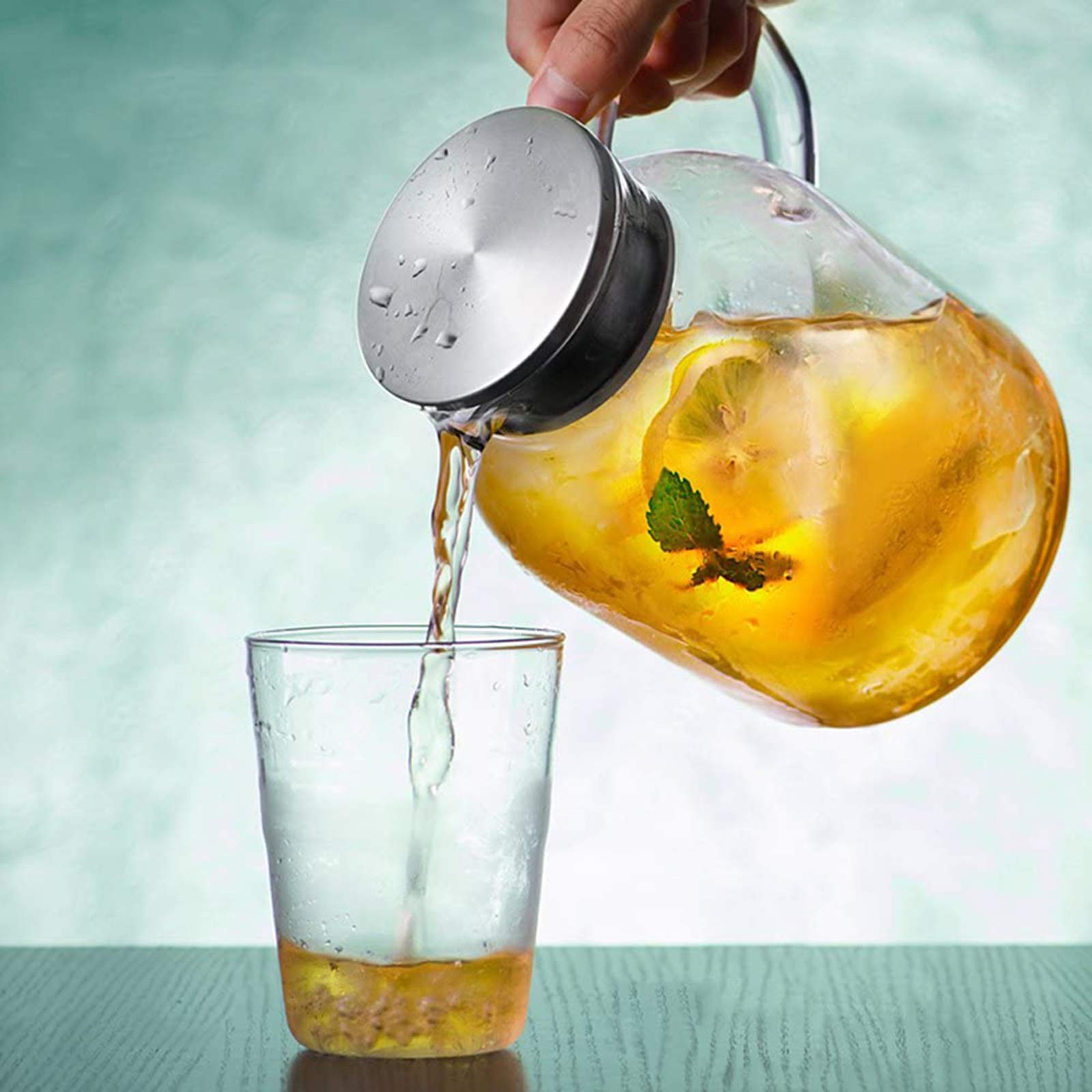 Abdodar pitcher pouring iced tea with clean pour spout.